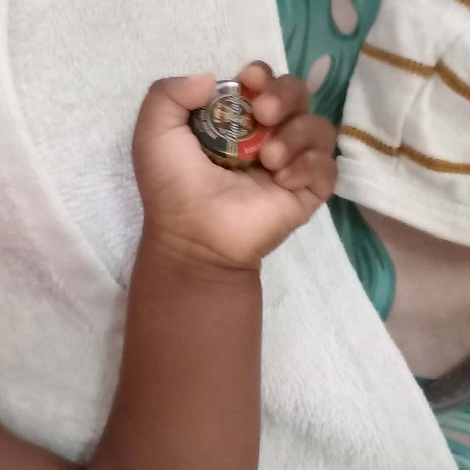 Home baby sindi with clean fresh clothes and about to prepare herself for feeding