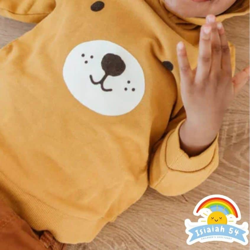 baby sindi with clean fresh clothes and about to prepare herself for feeding