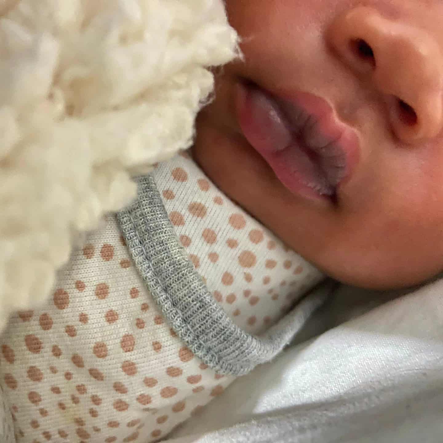 baby sindi with clean fresh clothes and about to prepare herself for feeding