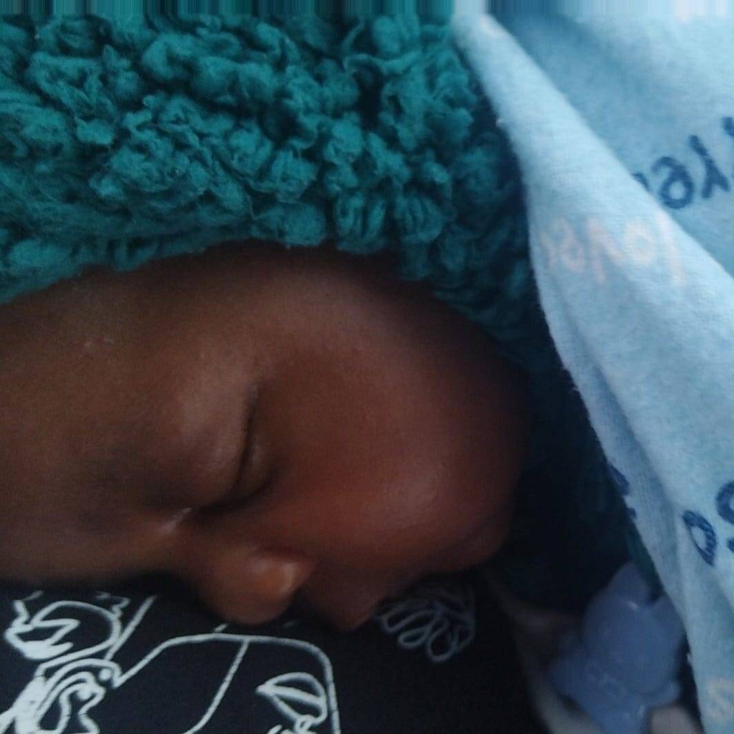 Home baby sindi with clean fresh clothes and about to prepare herself for feeding